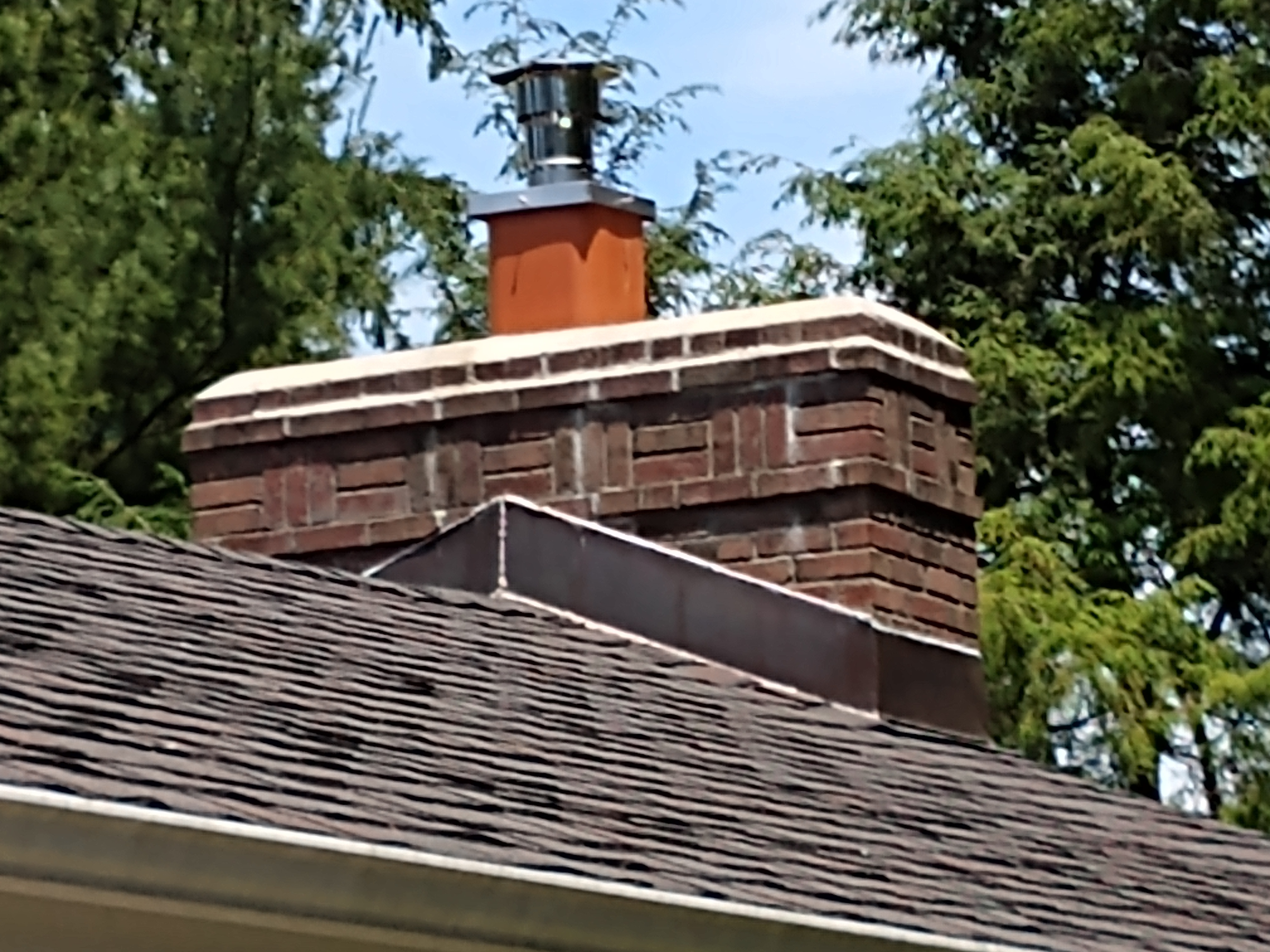 Stainless steel chimney cap with animal guard in Massapequa, New York